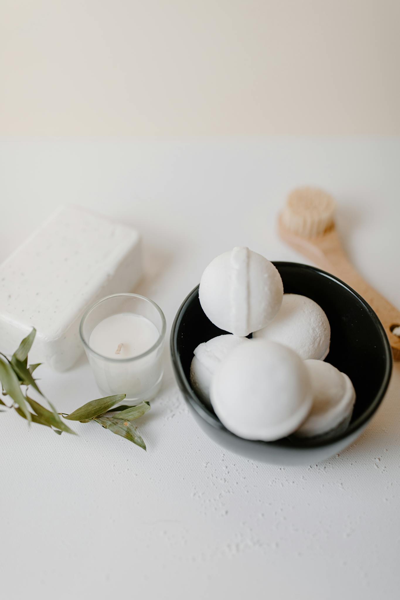 Elevate your spa experience with pristine white bath essentials and soothing candles.
